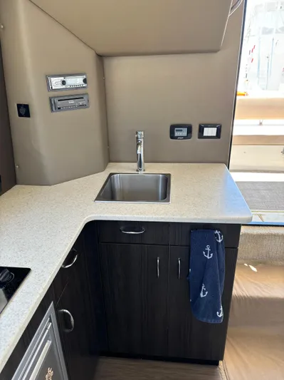  Yacht Photos Pics 2014 Carver C34 yacht kitchen with modern sink and countertop.