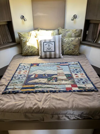  Yacht Photos Pics Cozy bedroom in 2014 Carver C34 with nautical-themed quilt and decorative pillows.