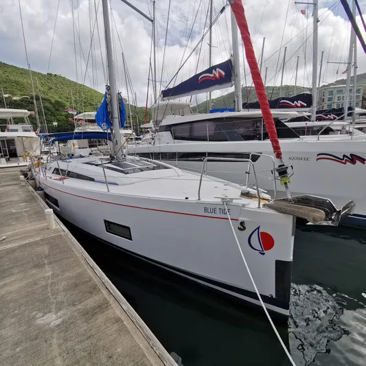 Blue Tide Yacht Photos Pics 2020 Beneteau Oceanis 46.1 yacht docked at marina, side view.