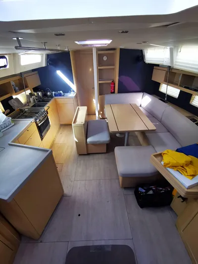 Blue Tide Yacht Photos Pics Interior of 2020 Beneteau Oceanis 46.1 yacht with modern kitchen and dining area.
