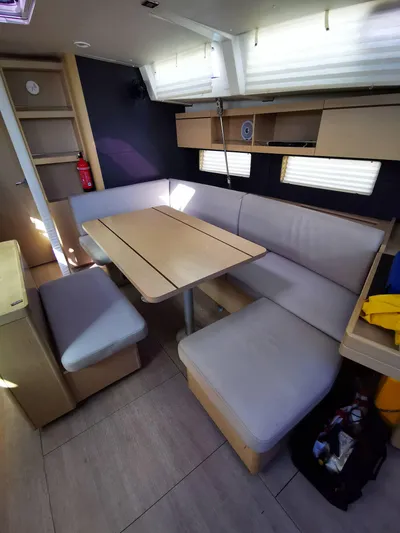 Blue Tide Yacht Photos Pics Interior of 2020 Beneteau Oceanis 46.1 yacht with cozy dining area and modern furnishings.