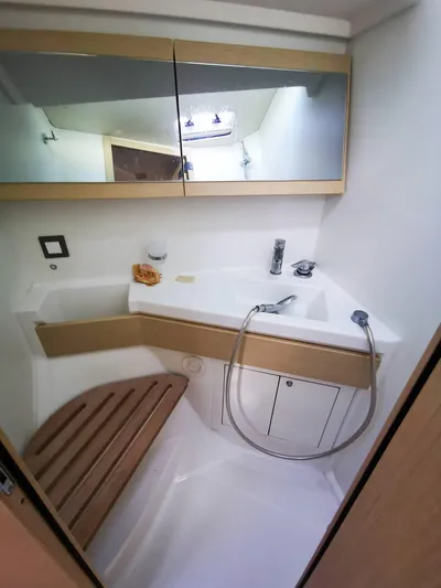 Blue Tide Yacht Photos Pics Beneteau Oceanis 46.1 2020 yacht bathroom with modern fixtures and wooden accents.