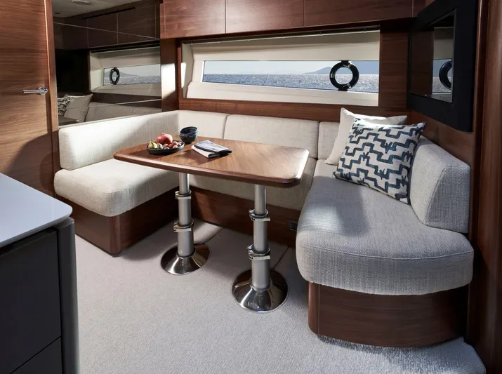50 Princess V50 2026 Yacht Photos Pics Luxurious interior of 2026 Princess V50 Deck Salon yacht with elegant seating and table.