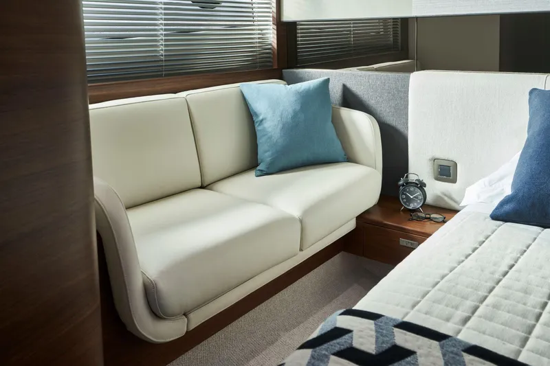 50 Princess V50 2026 Yacht Photos Pics Luxurious interior of 2026 Princess V50 Deck Salon with elegant sofa and decor.