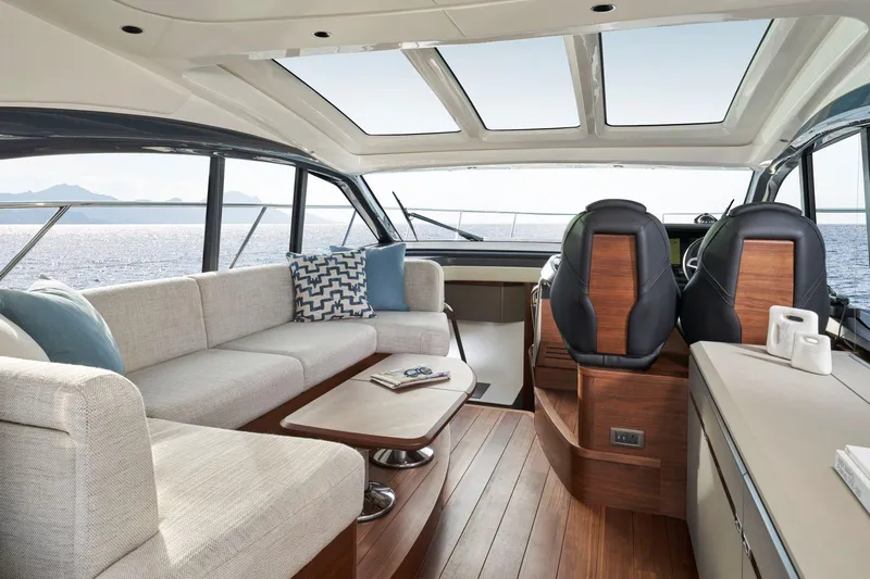 50 Princess V50 2026 Yacht Photos Pics Luxurious 2026 Princess V50 Deck Salon interior with elegant seating and panoramic windows.