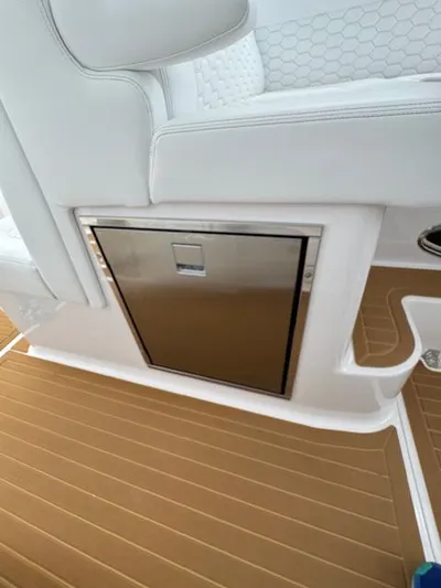  Yacht Photos Pics 2023 Southport 33 DC boat interior with sleek seating and built-in storage.