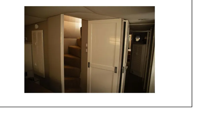 "focus" Yacht Photos Pics 1977 Hatteras 58 Yacht Fisherman interior with staircase and hallway view.