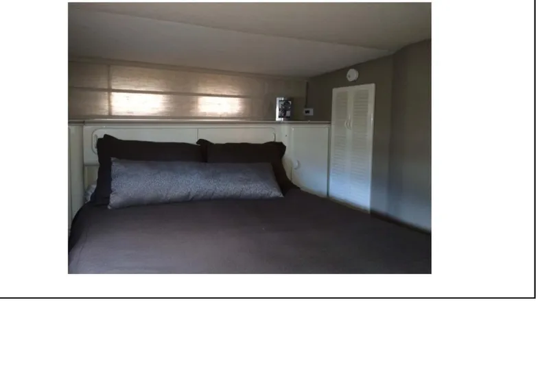 "focus" Yacht Photos Pics Interior cabin of 1977 Hatteras 58 Yacht Fisherman with bed and storage.