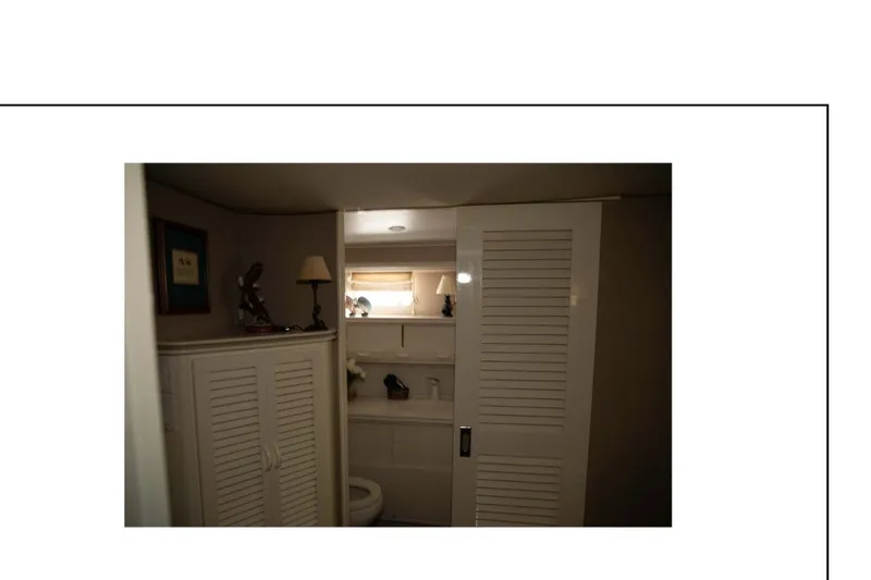 "focus" Yacht Photos Pics 1977 Hatteras 58 Yacht Fisherman interior bathroom with white cabinets and decor.