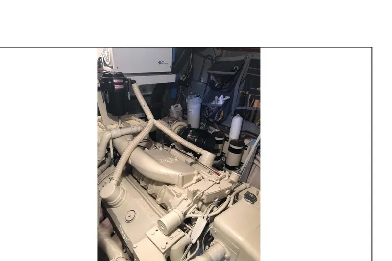 "focus" Yacht Photos Pics Engine room of 1977 Hatteras 58 Yacht Fisherman, showcasing mechanical components.