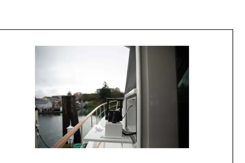 "focus" Yacht Photos Pics 1977 Hatteras 58 Yacht Fisherman docked, showcasing deck details and marina view.