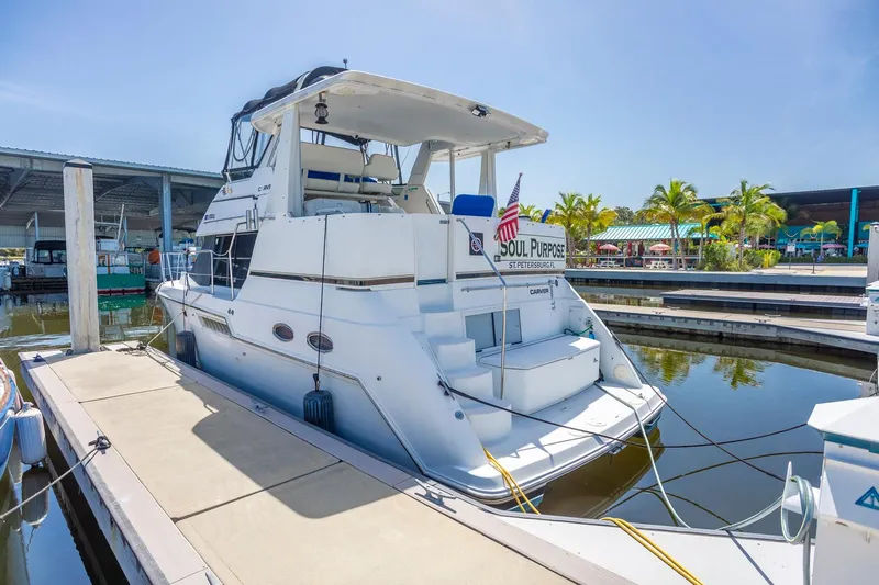  Yacht Photos Pics 2000 Carver 356 Aft Cabin Motor Yacht docked at marina under clear sky.