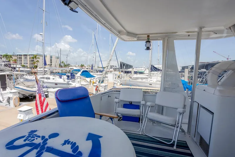  Yacht Photos Pics 2000 Carver 356 Aft Cabin Motor Yacht docked, featuring outdoor seating and marina view.