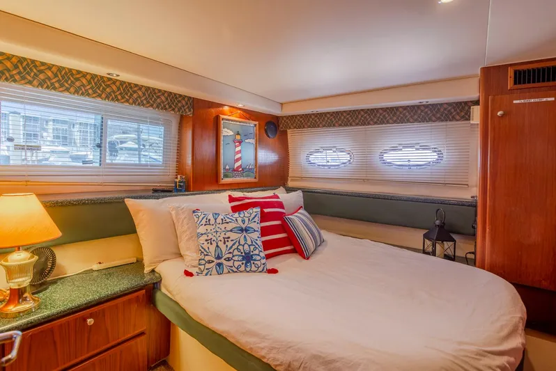  Yacht Photos Pics Luxurious bedroom in 2000 Carver 356 Aft Cabin Motor Yacht with nautical decor.
