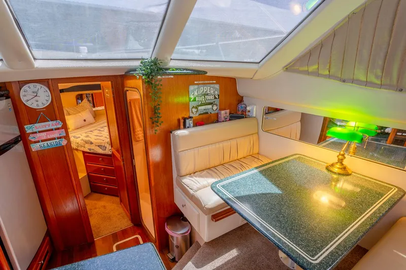  Yacht Photos Pics Interior of 2000 Carver 356 Aft Cabin Motor Yacht with cozy dining area.