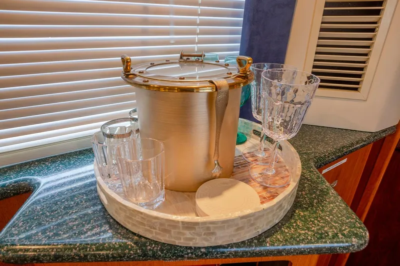  Yacht Photos Pics Luxurious yacht interior with ice bucket and glasses on a countertop, Carver 356 Aft Cabin Motor Yacht.