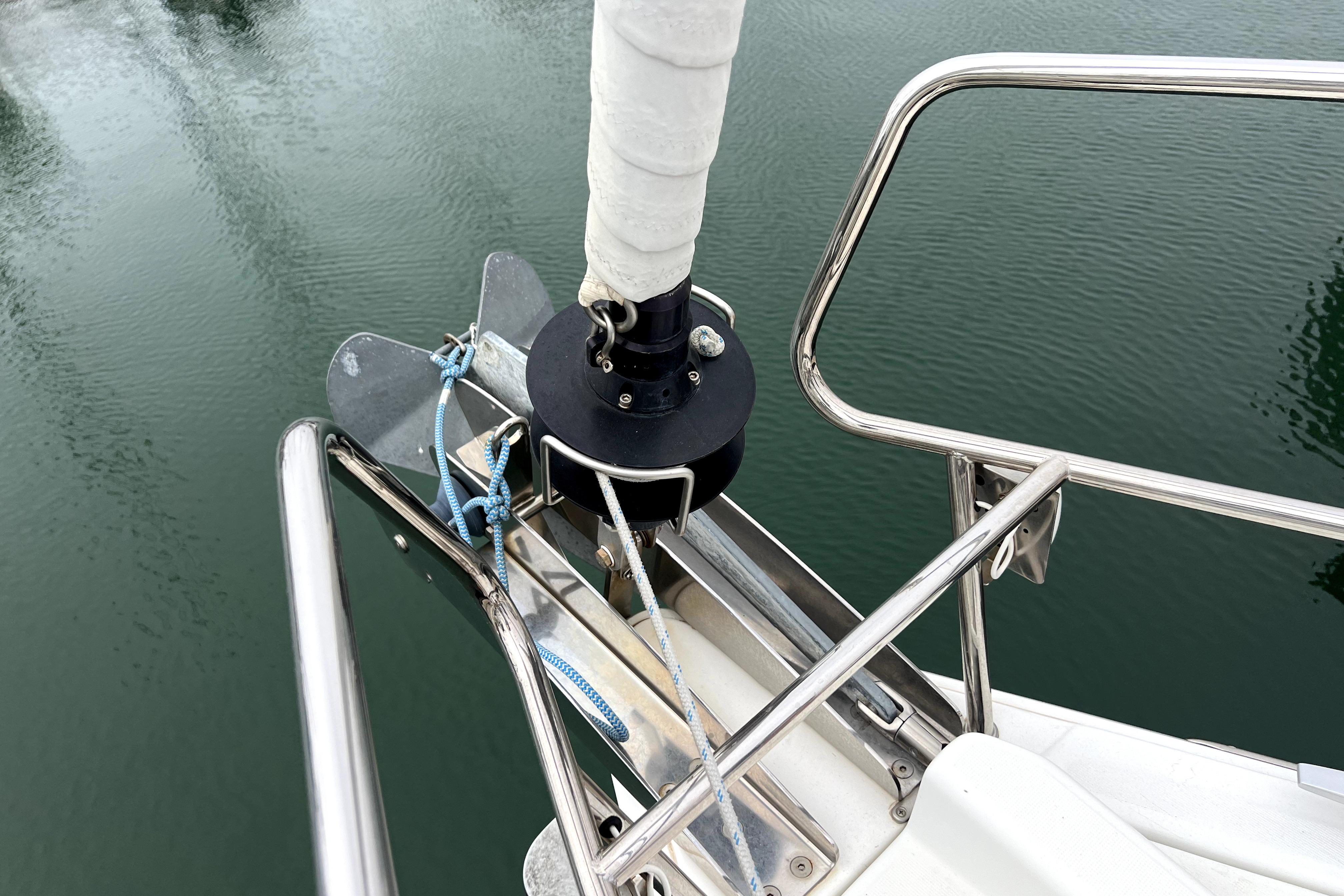 Bow of 2014 Jeanneau Sun Odyssey 379 sailboat with anchor and railing.