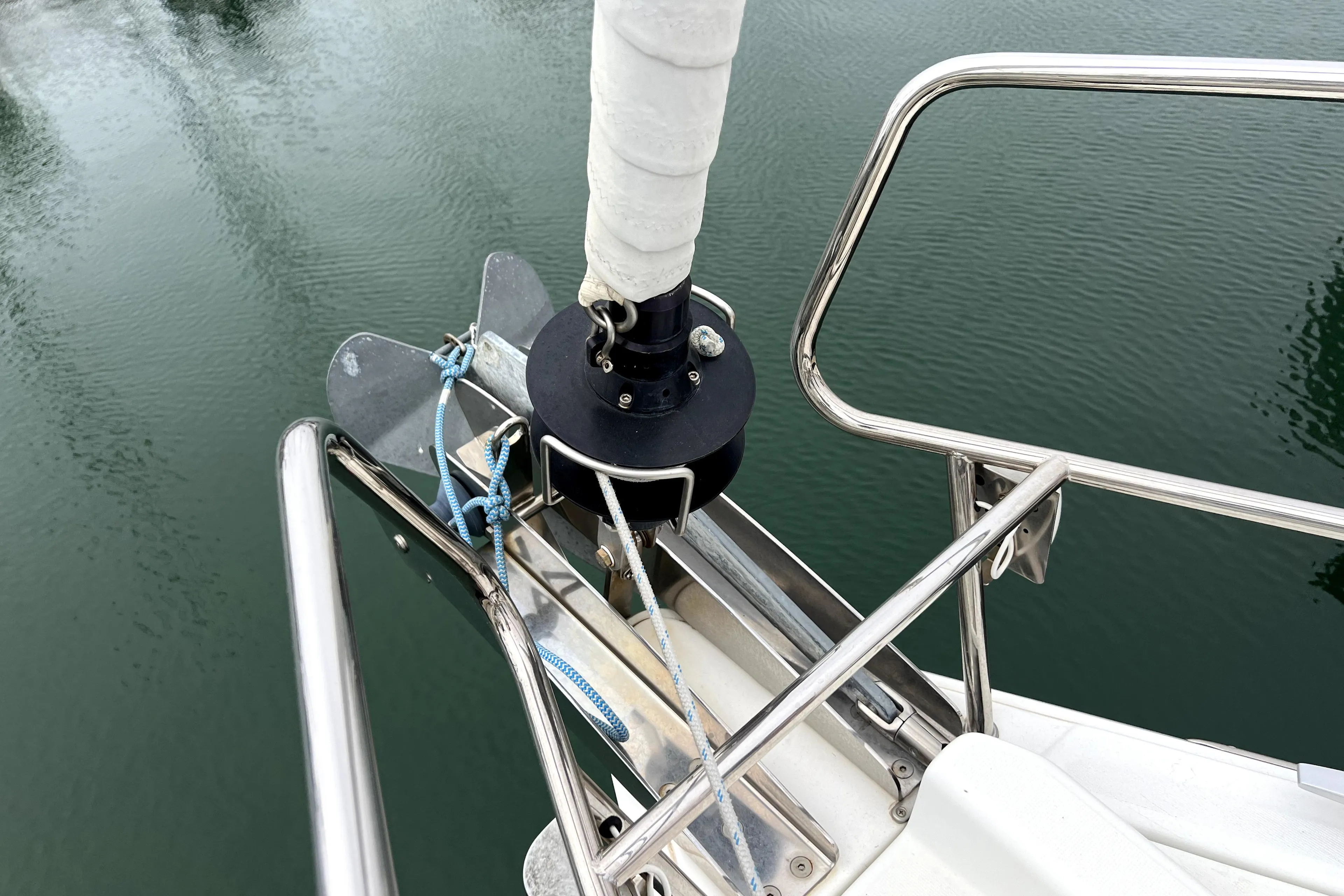 Bow of 2014 Jeanneau Sun Odyssey 379 sailboat with anchor and railing.