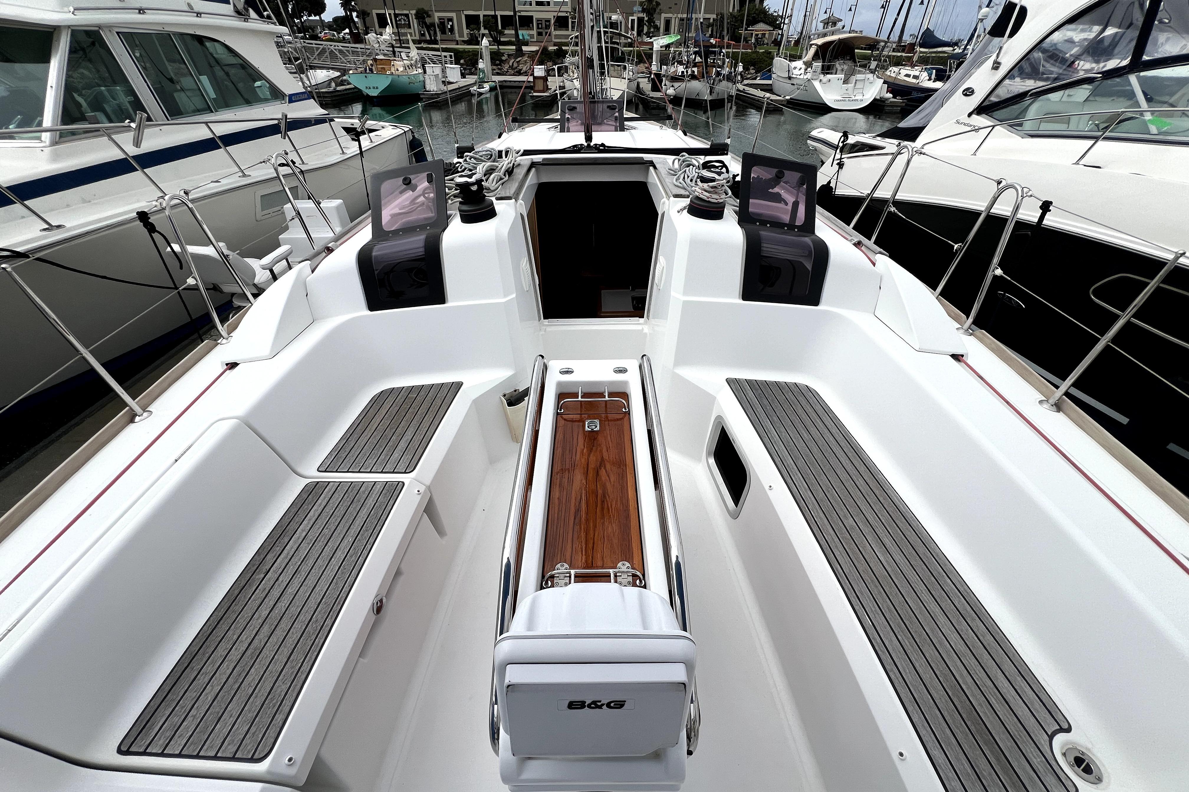 Cockpit of 2014 Jeanneau Sun Odyssey 379 sailboat, featuring sleek design and modern navigation equipment.