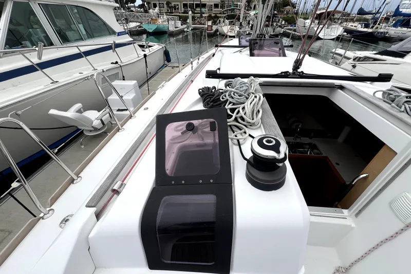 Knot Behaving Yacht Photos Pics 2014 Jeanneau Sun Odyssey 379 sailboat deck with ropes and winch in marina.