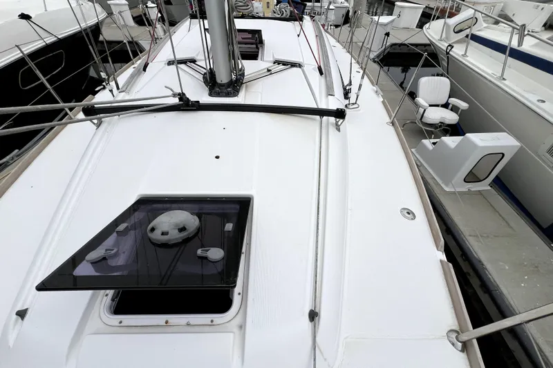 Knot Behaving Yacht Photos Pics 2014 Jeanneau Sun Odyssey 379 sailboat deck view at marina.