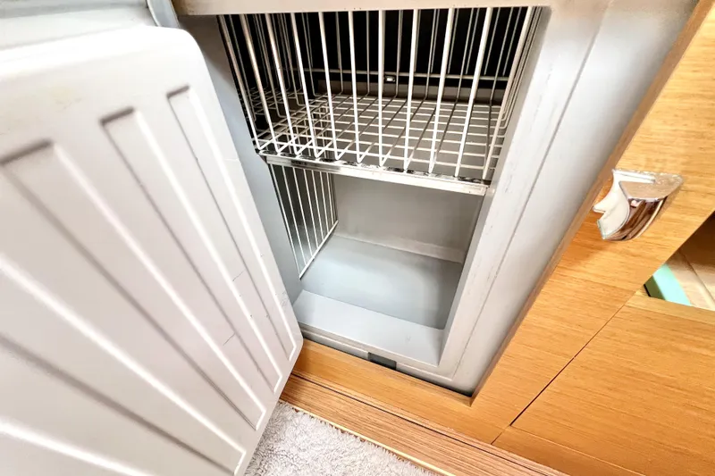 Knot Behaving Yacht Photos Pics Open refrigerator in 2014 Jeanneau Sun Odyssey 379 yacht interior.