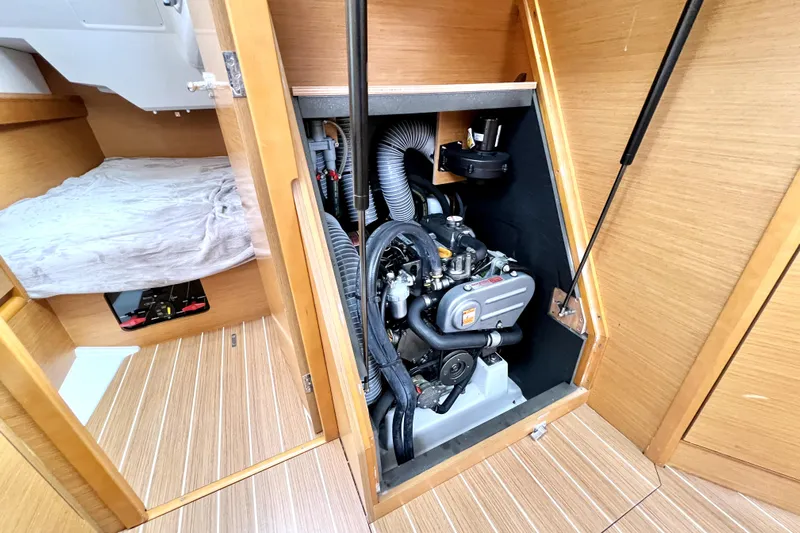 Knot Behaving Yacht Photos Pics Engine compartment of 2014 Jeanneau Sun Odyssey 379 sailboat, showcasing interior design and mechanics.