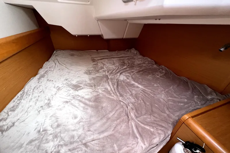 Knot Behaving Yacht Photos Pics Cozy cabin bed in 2014 Jeanneau Sun Odyssey 379 sailboat interior.