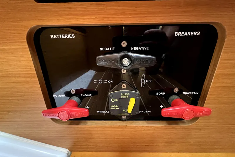 Knot Behaving Yacht Photos Pics Control panel of a 2014 Jeanneau Sun Odyssey 379 sailboat, featuring battery and breaker switches.