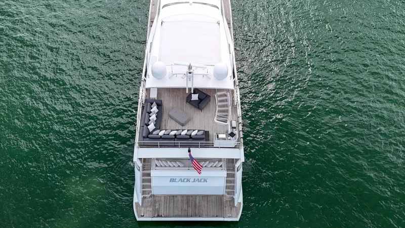  Yacht Photos Pics Aerial view of 2017 Azimut 95 Raised Pilothouse yacht on green water.
