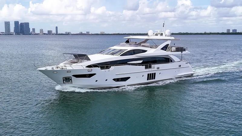  Yacht Photos Pics Luxurious 2017 Azimut 95 Raised Pilothouse yacht cruising on open water.
