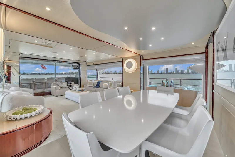  Yacht Photos Pics Luxurious interior of 2017 Azimut 95 Raised Pilothouse yacht with elegant dining area.