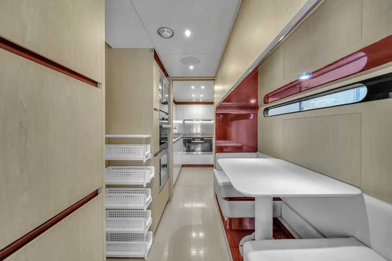  Yacht Photos Pics Modern kitchen interior of 2017 Azimut 95 Raised Pilothouse yacht, featuring sleek design and appliances.