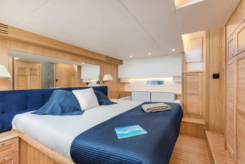  Yacht Photos Pics Luxurious cabin interior of 2025 Sasga Yachts Menorquin 55 Flybridge with elegant wood finish.