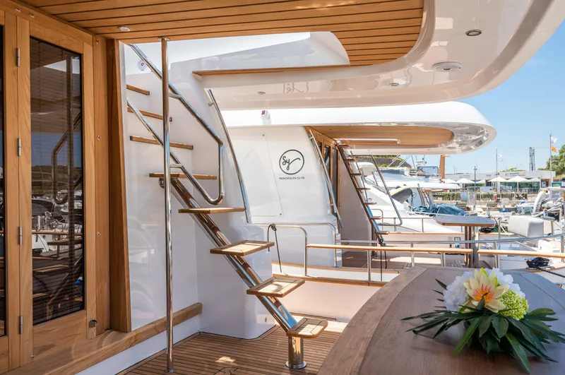  Yacht Photos Pics Luxurious 2025 Sasga Yachts Menorquin 55 Flybridge with elegant wooden deck and modern design.