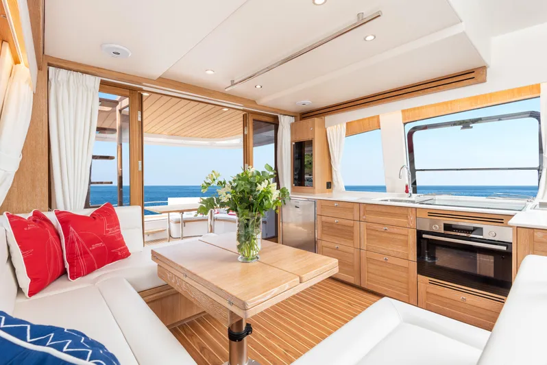  Yacht Photos Pics Luxurious interior of 2025 Sasga Yachts Menorquin 55 Flybridge with ocean view and modern amenities.