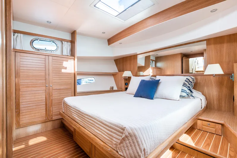  Yacht Photos Pics Luxurious cabin interior of 2025 Sasga Yachts Menorquin 55 Flybridge with wood finish.
