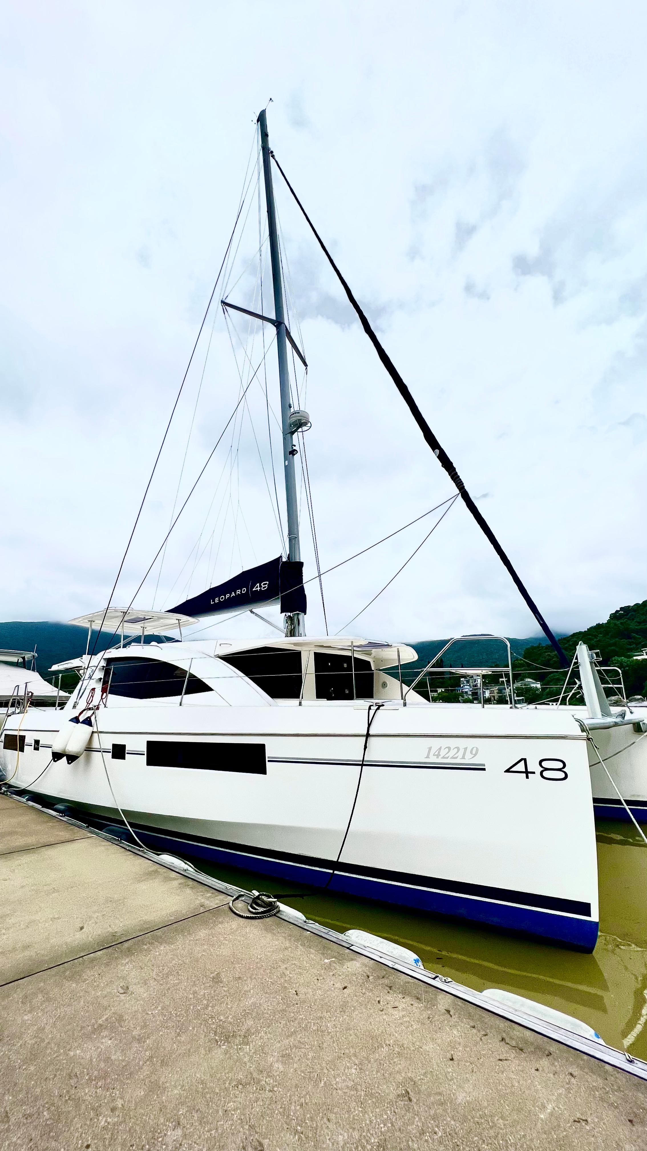 2015 Leopard 48 yacht docked, showcasing sleek design and modern features.