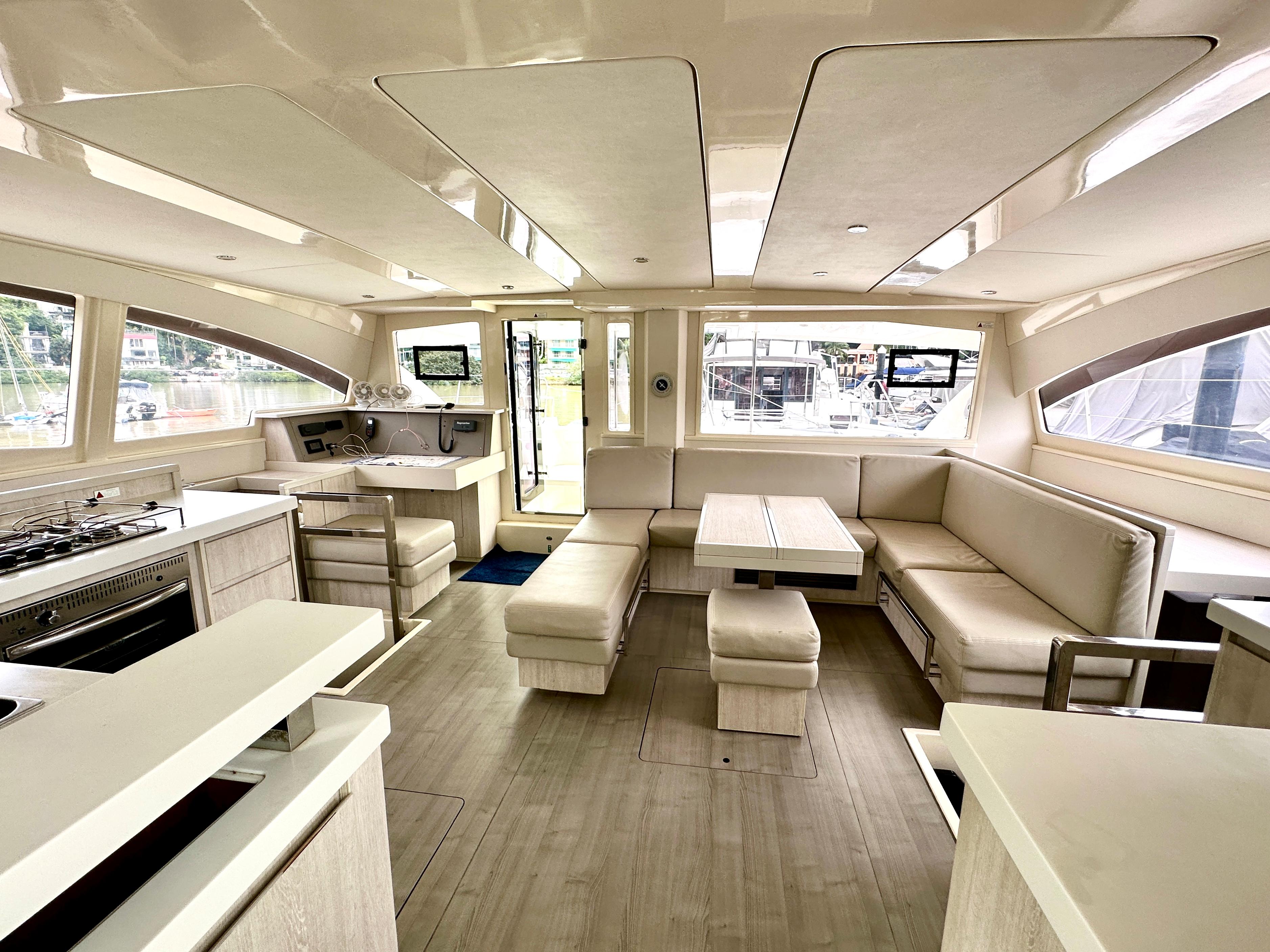 Luxurious interior of 2015 Leopard 48 yacht with spacious seating and modern amenities.
