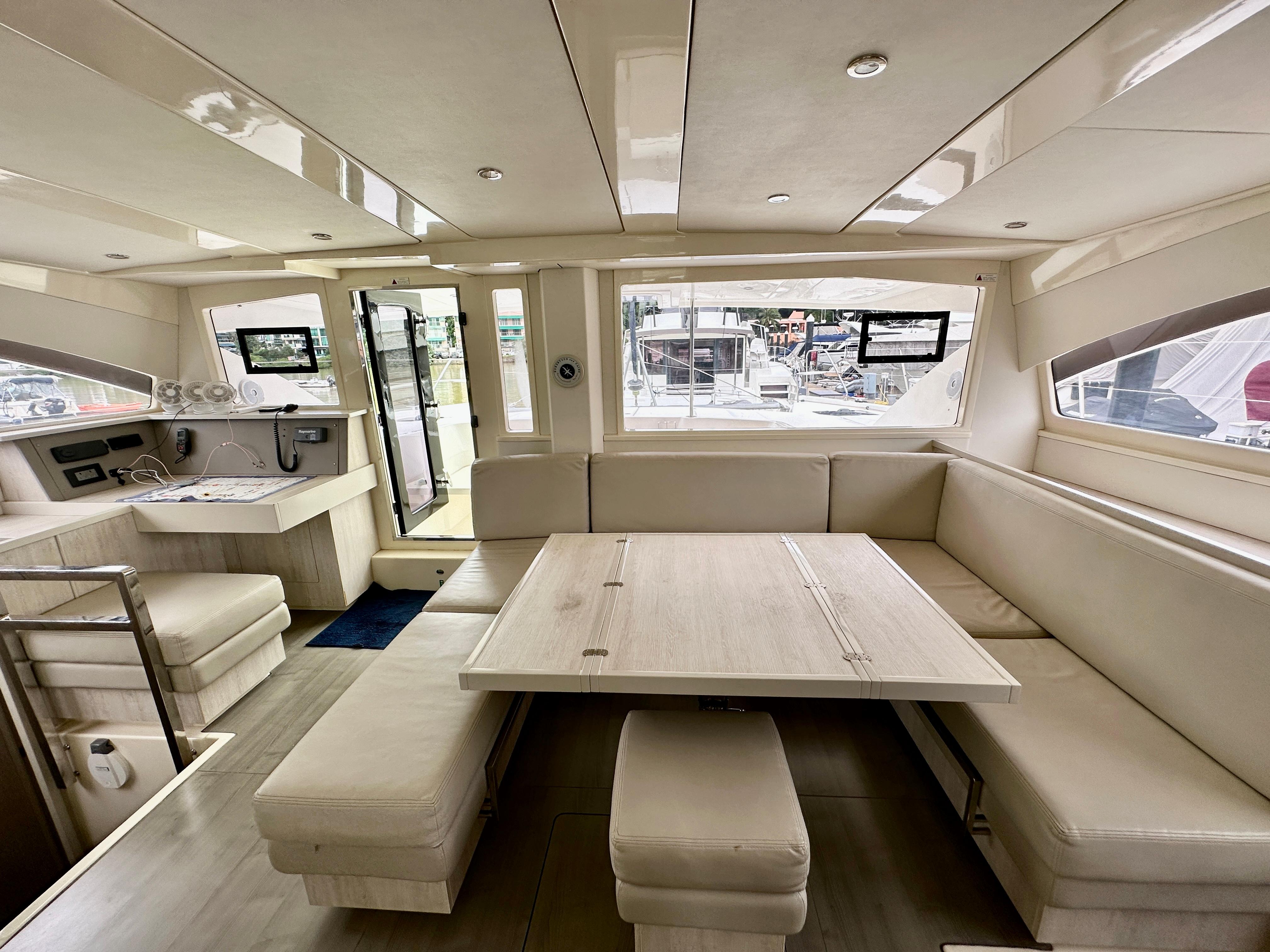 Luxurious interior of a 2015 Leopard 48 yacht with spacious seating and modern design.