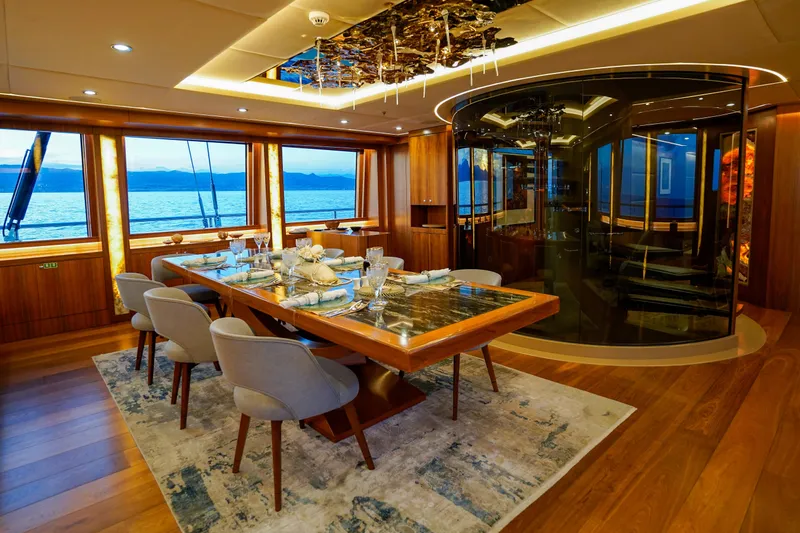 Aresteas Yacht Photos Pics Luxurious dining area on 2017 Custom Yildizlar yacht with ocean view and elegant decor.