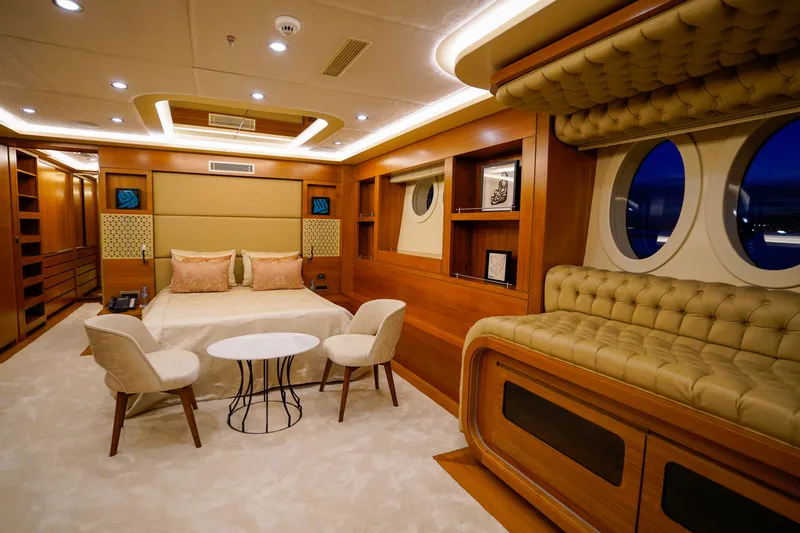Aresteas Yacht Photos Pics Luxurious yacht bedroom interior with elegant wood finishes, plush seating, and ambient lighting, 2017 Yildizlar.