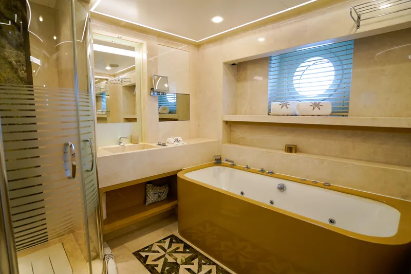 Aresteas Yacht Photos Pics Luxurious bathroom with jacuzzi, glass shower, and elegant decor on a 2017 Custom Yildizlar yacht.