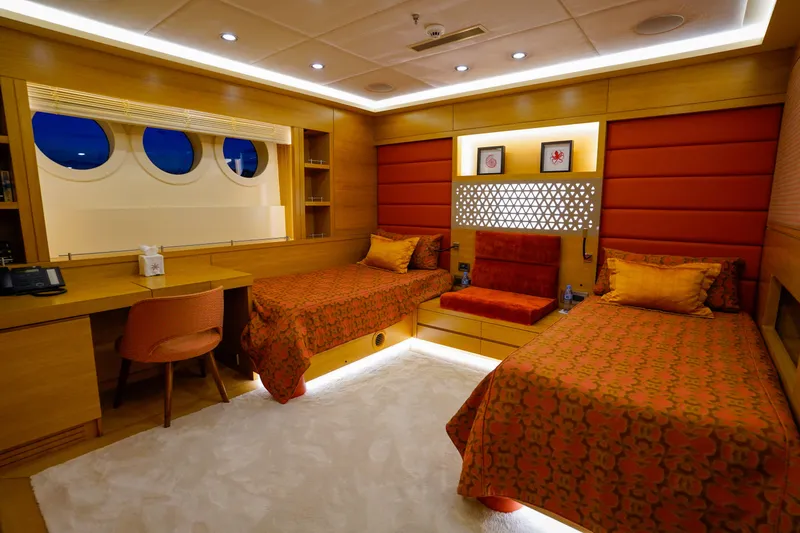 Aresteas Yacht Photos Pics Luxurious twin cabin on 2017 Custom Yildizlar yacht with elegant decor and porthole windows.