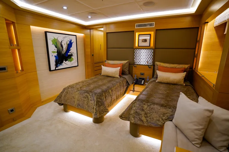 Aresteas Yacht Photos Pics Luxurious twin bedroom on 2017 Custom Yildizlar yacht, featuring modern decor and ambient lighting.