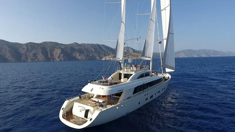 Aresteas Yacht Photos Pics Luxurious 2017 Custom Yildizlar yacht sailing on a serene blue sea with mountainous backdrop.