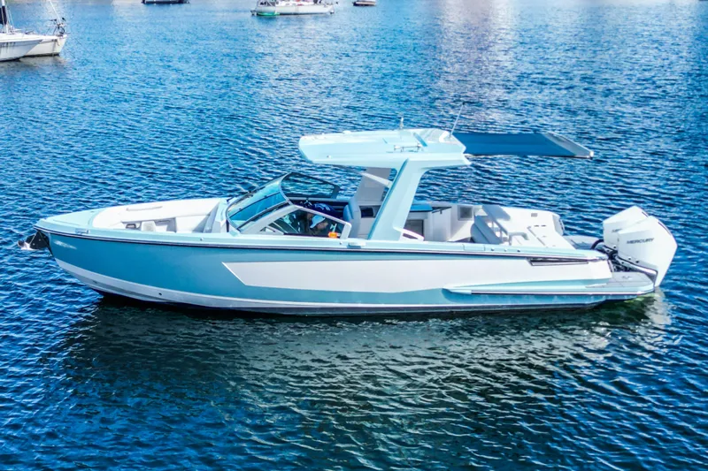  Yacht Photos Pics 2022 Aviara AV32 OB boat on calm blue water, featuring sleek design and modern amenities.