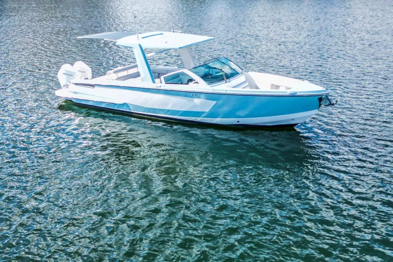  Yacht Photos Pics 2022 Aviara AV32 OB boat on calm water, showcasing sleek design and modern features.