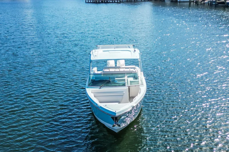  Yacht Photos Pics 2022 Aviara AV32 OB boat on sparkling water, front view.