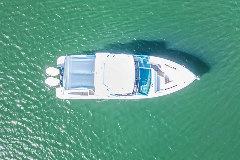  Yacht Photos Pics Aerial view of 2022 Aviara AV32 OB boat on green water.